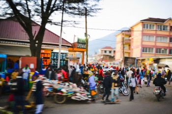 Ugandan streets with motorcycle and car traffic how to travel uganda