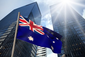 Australian flag against skyscrapers
