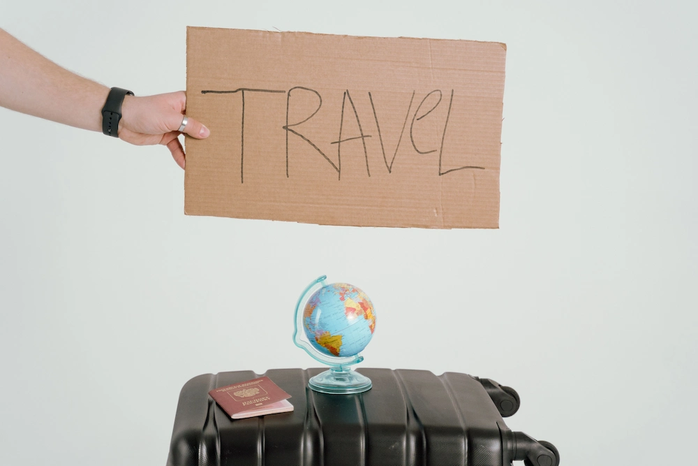 Documentation and requirements for traveling to Indonesia Travel suitcase with passport and globe, documentation for traveling to Indonesia